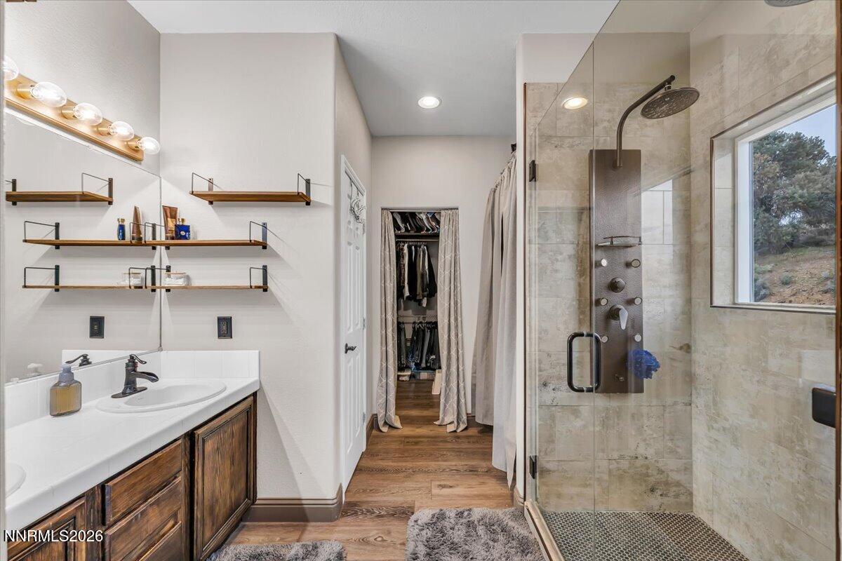 15770 Rocky Vista Road Reno, NV 89521 - Photo 20 of 68 a bathroom with a sink double vanity and shower