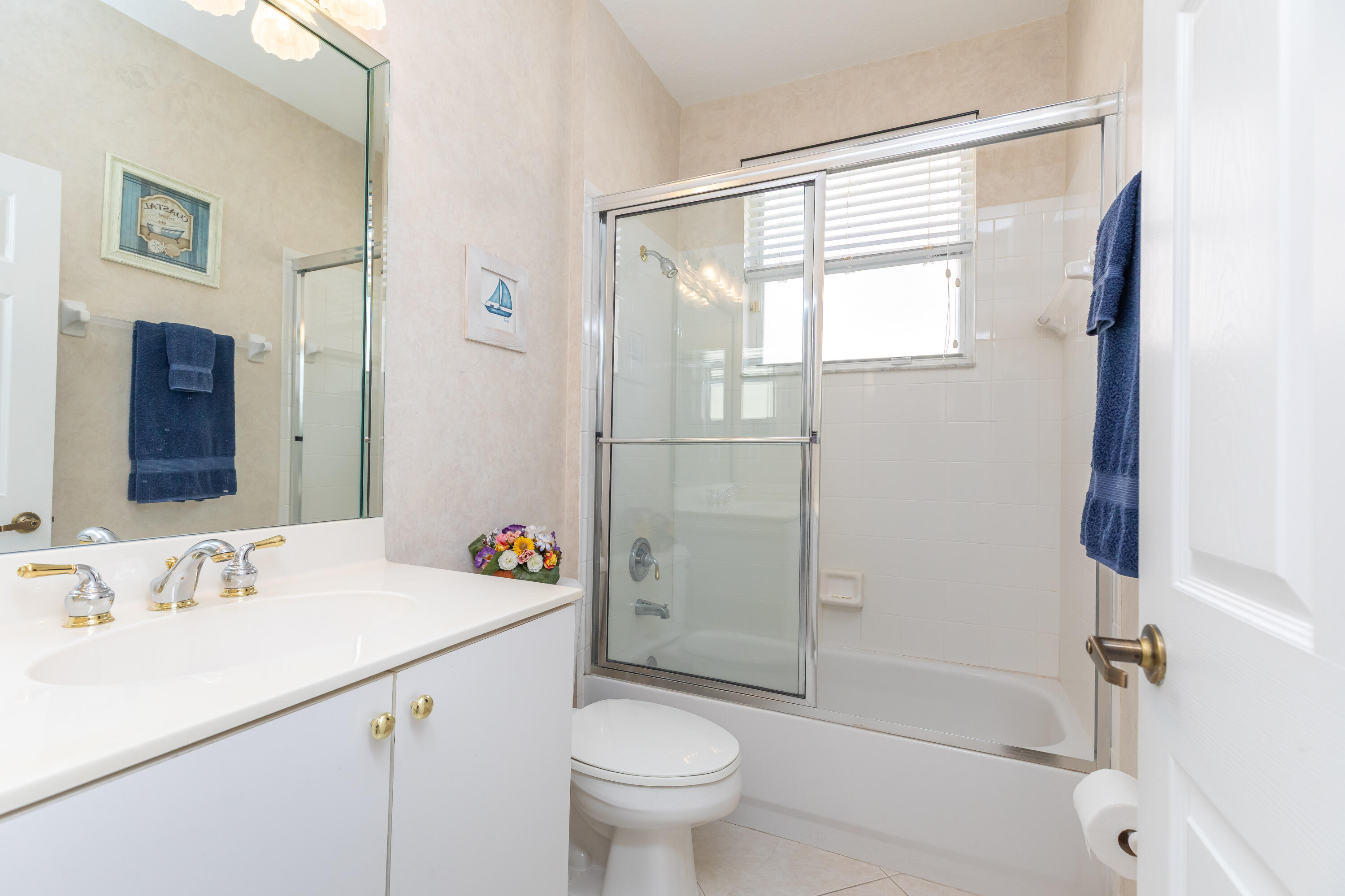 6698 Vía Roma Delray Beach, FL 33446 - Photo 19 of 50 a bathroom with a sink a toilet and shower