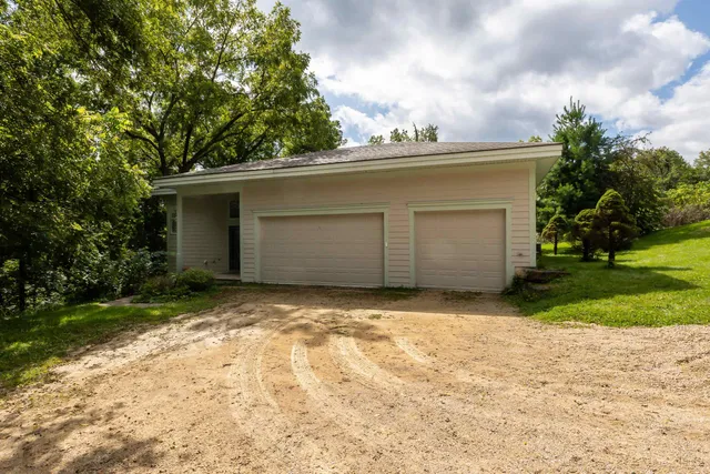 a view of yellow house with a yard