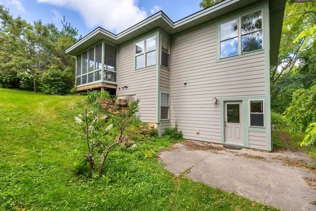 a view of a house with a yard and plants