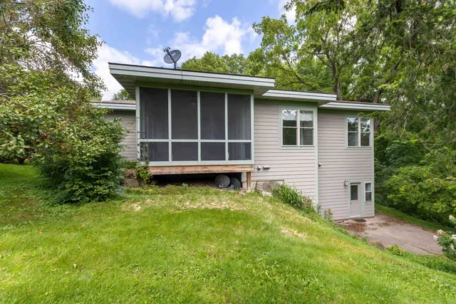 a house with trees in the background