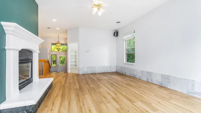 a view of livingroom with furniture wooden floor and window