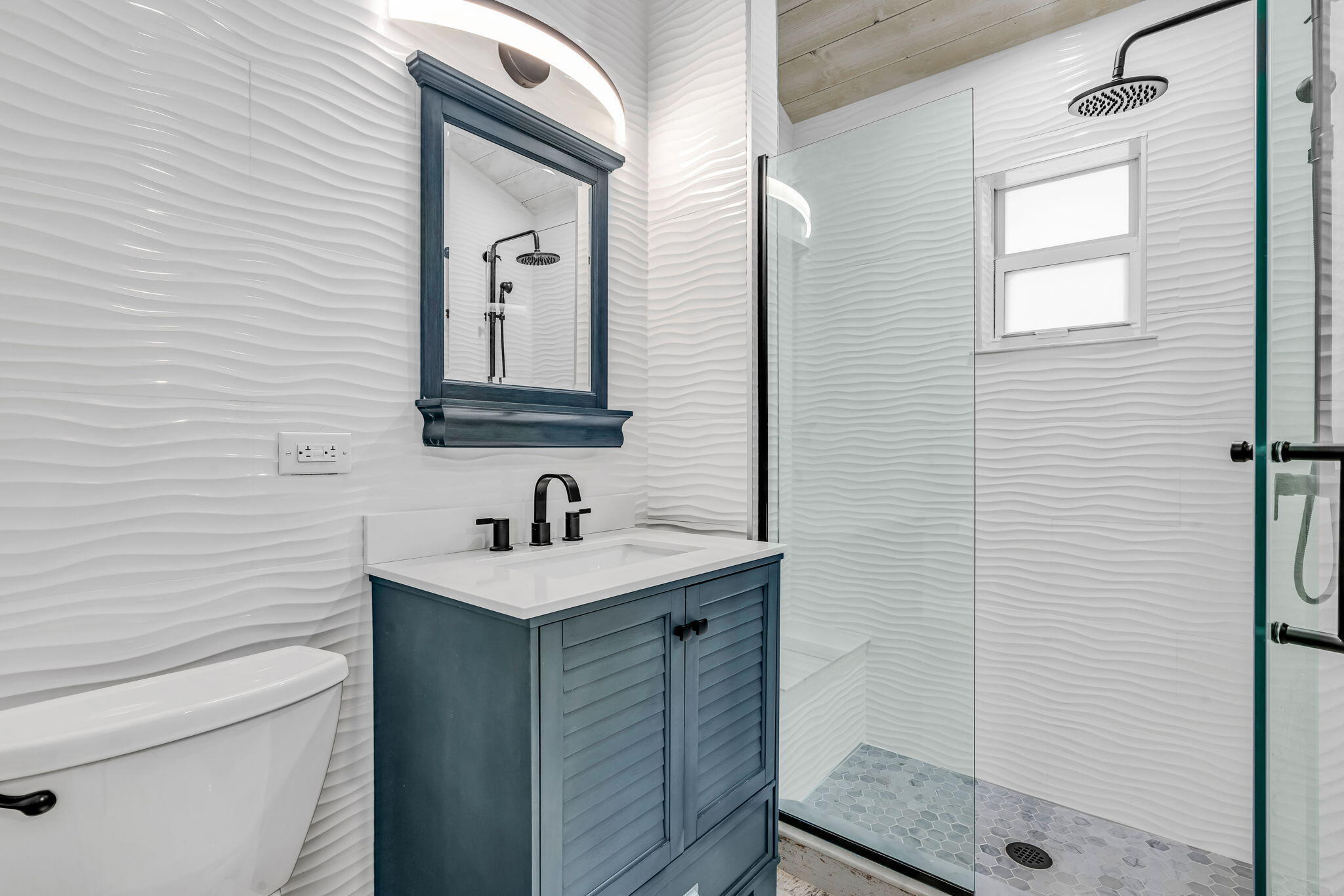 218 Lignumvitae Drive Key Largo, FL 33037 - Photo 17 of 35 a bathroom with a sink a toilet and shower