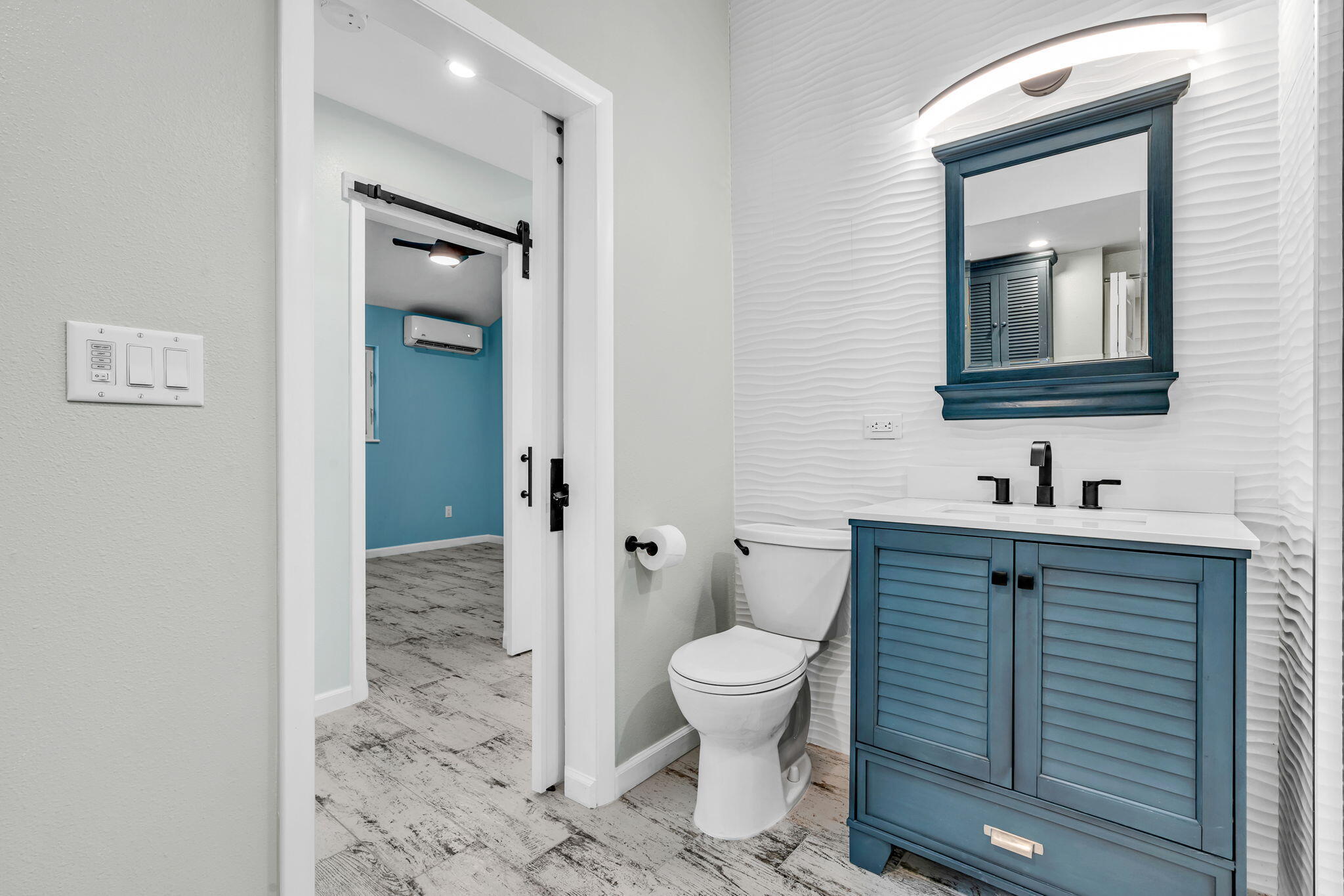 218 Lignumvitae Drive Key Largo, FL 33037 - Photo 20 of 35 a bathroom with a toilet sink and mirror