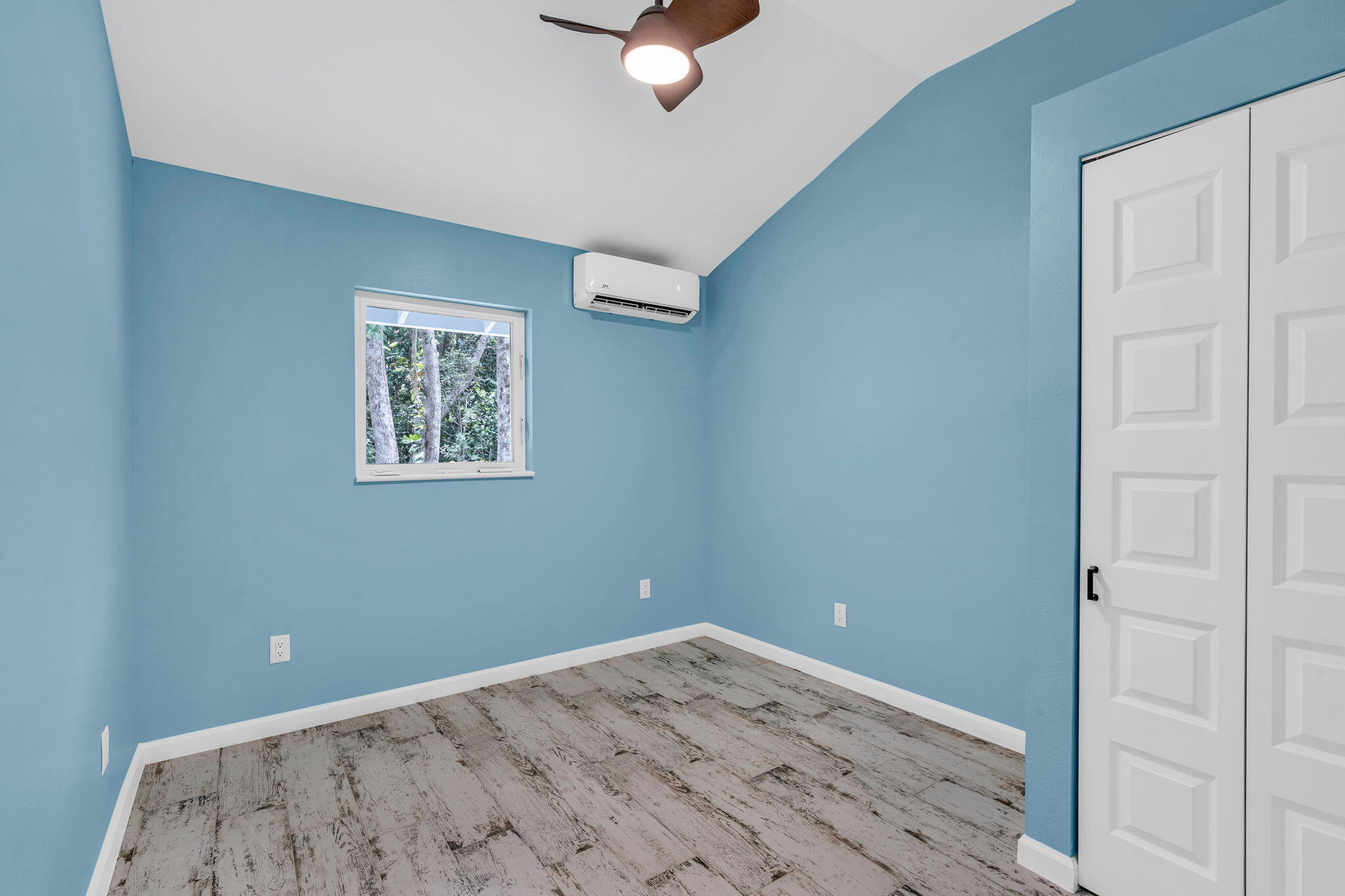 218 Lignumvitae Drive Key Largo, FL 33037 - Photo 21 of 35 a view of a room with wooden floor and carpet