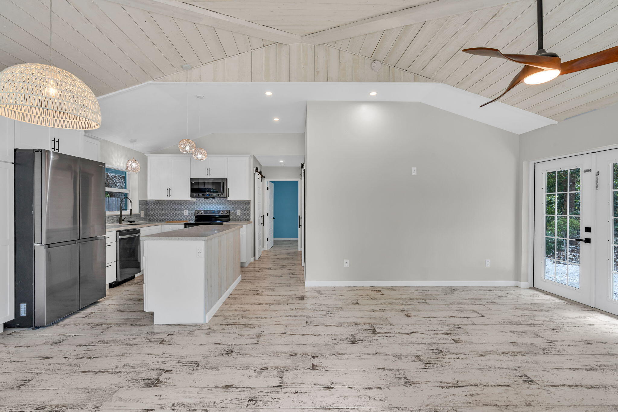 218 Lignumvitae Drive Key Largo, FL 33037 - Photo 3 of 35 a kitchen with refrigerator and cabinets