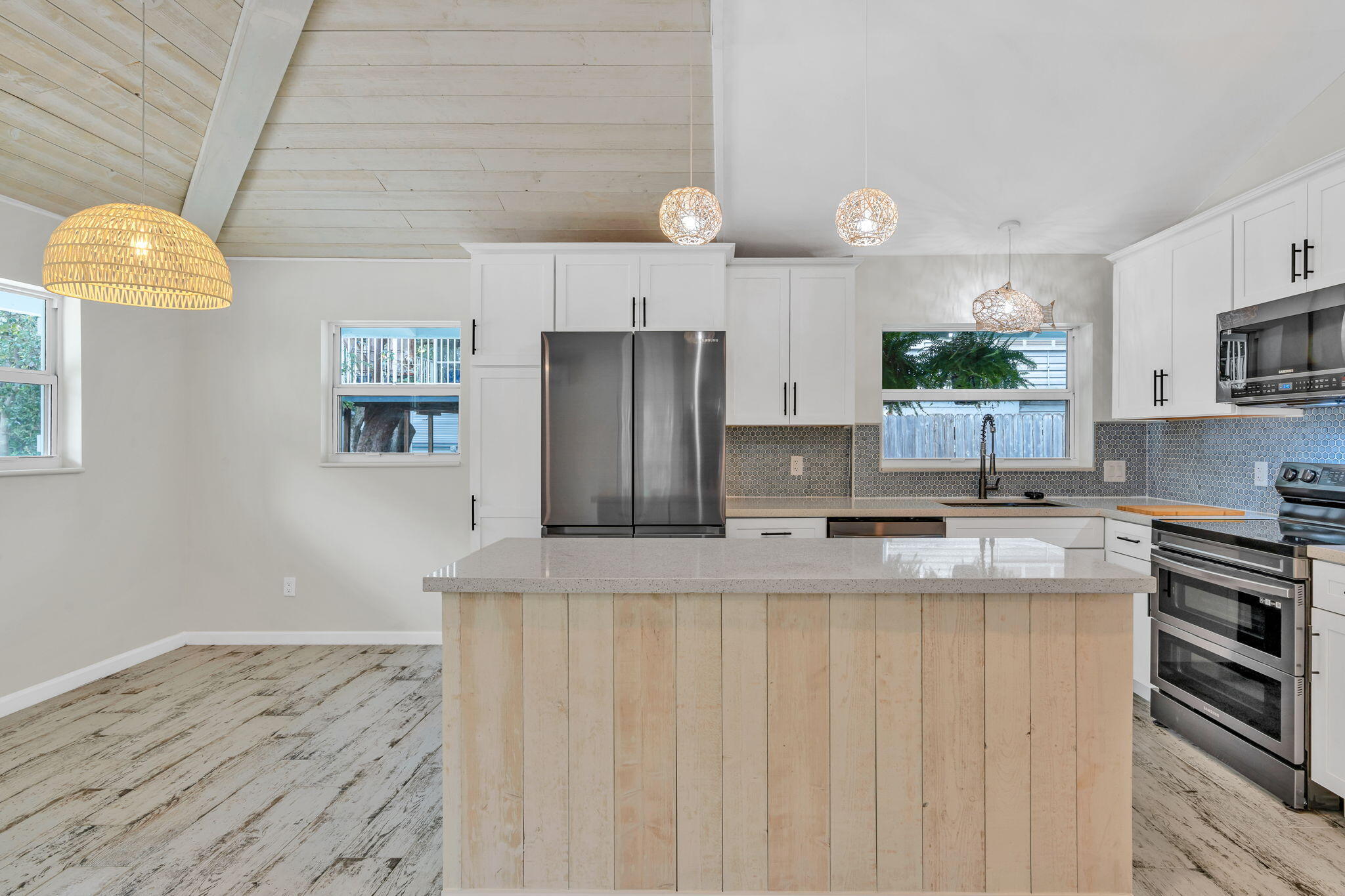 218 Lignumvitae Drive Key Largo, FL 33037 - Photo 7 of 35 a kitchen with stainless steel appliances granite countertop a refrigerator a stove and a sink