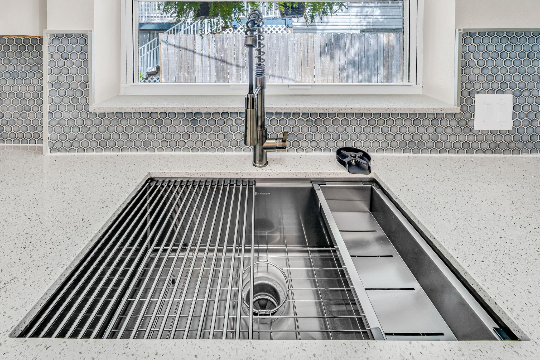 218 Lignumvitae Drive Key Largo, FL 33037 - Photo 10 of 35 a close view of kitchen appliances with wooden floor