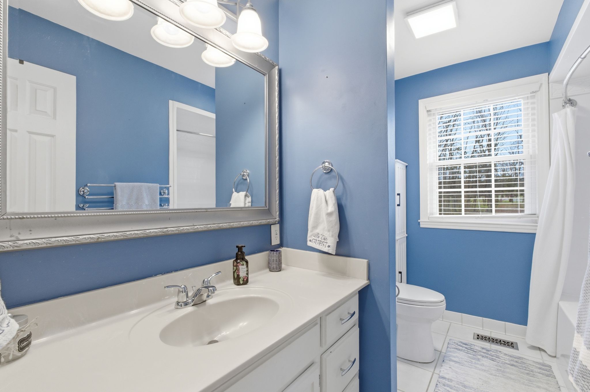 4708 Hessey Road Mount Juliet, TN 37122 - Photo 16 of 44 a bathroom with a sink a toilet and a mirror