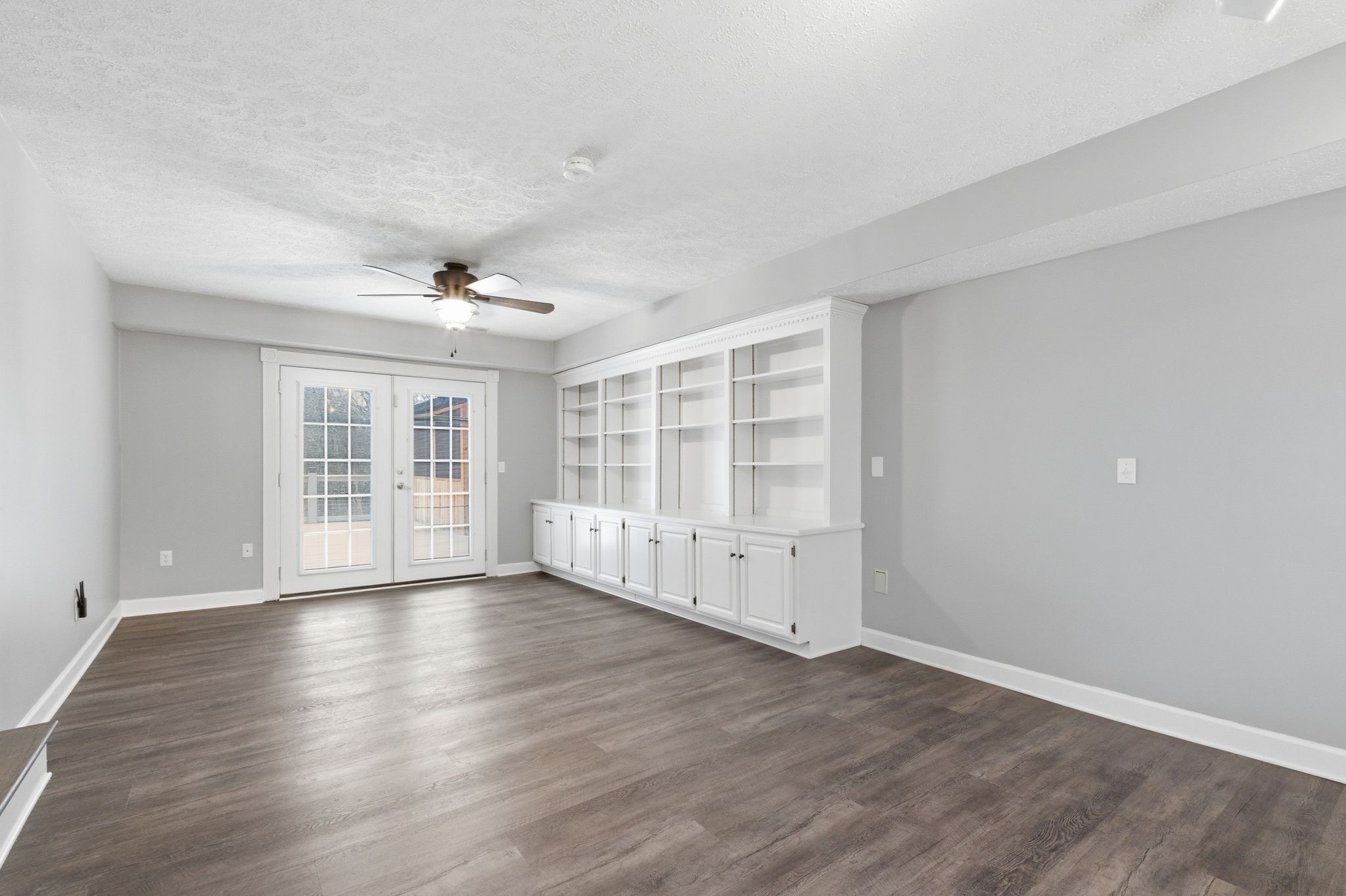 4708 Hessey Road Mount Juliet, TN 37122 - Photo 19 of 44 a view of an empty room with wooden floor and windows