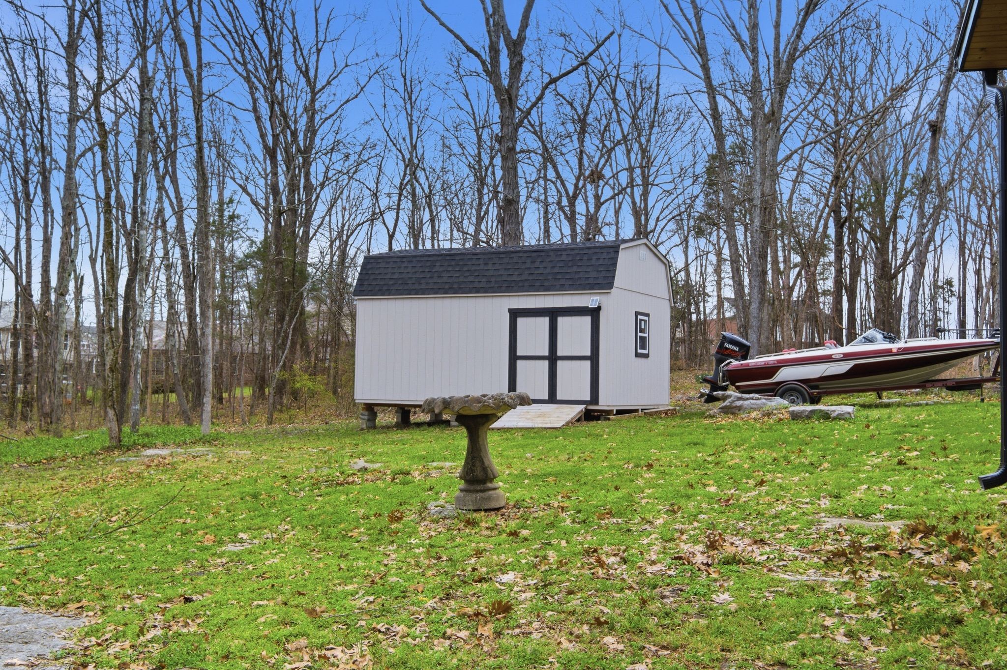 4708 Hessey Road Mount Juliet, TN 37122 - Photo 23 of 44 a backyard of a house with barbeque oven and trees