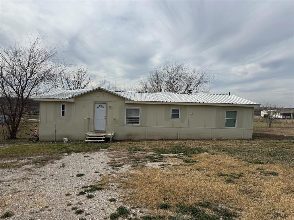 118 Happy Trl Court Rhome, TX 76078 - Photo 1 of 9 a house with trees in the background