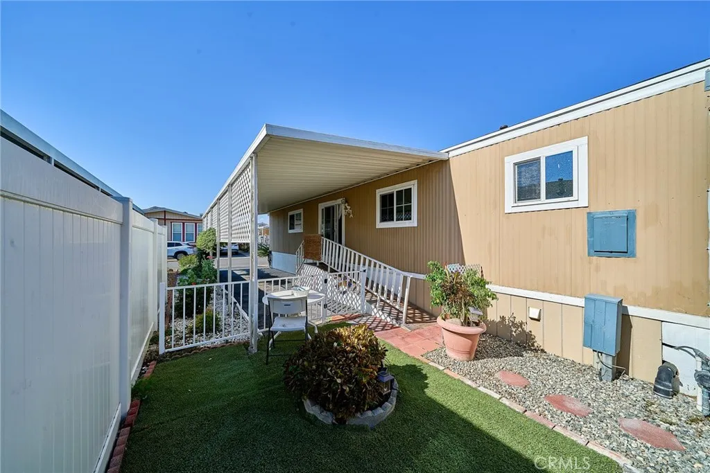 4000 Pierce Street, Unit 168 Riverside, CA 92505 - Photo 23 of 34 a front view of a house with a yard