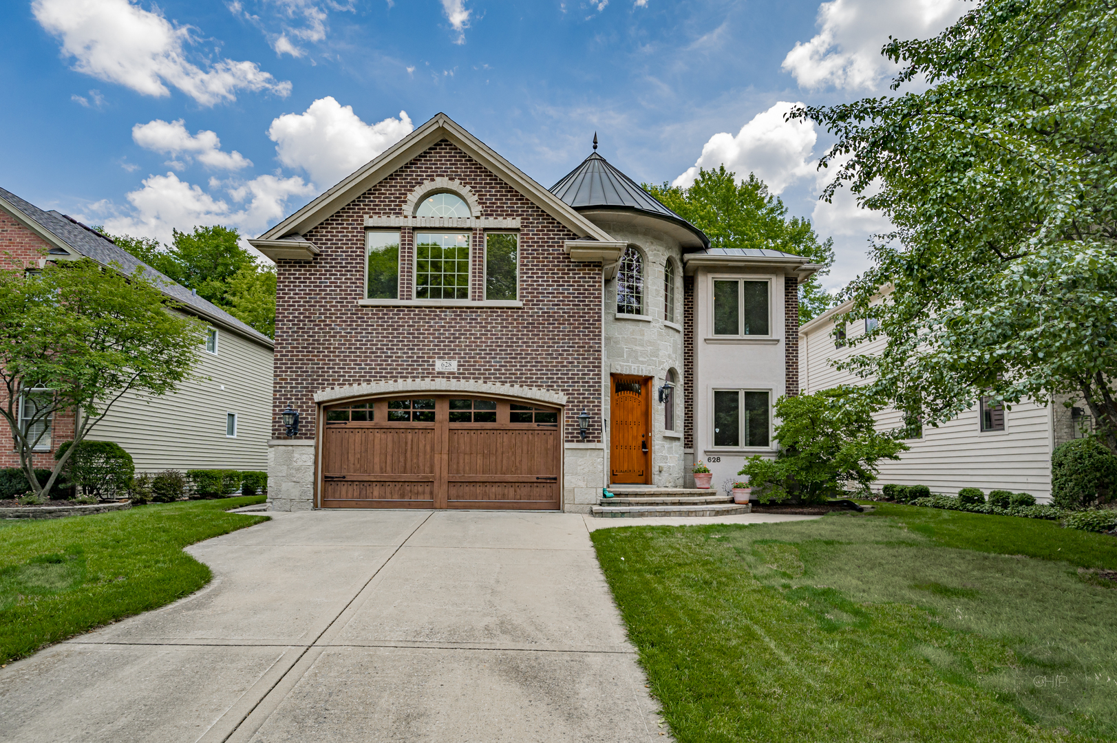 628 North Webster Street Naperville, IL 60563 - Photo 1 of 1 a front view of a house with a yard and trees