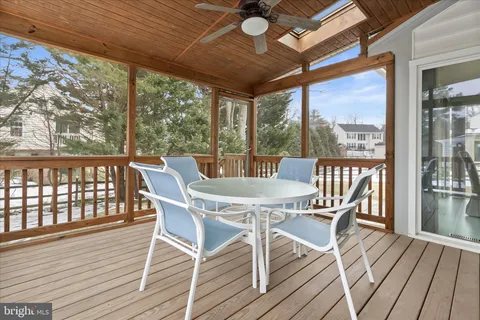 a view of a patio with a table and chairs