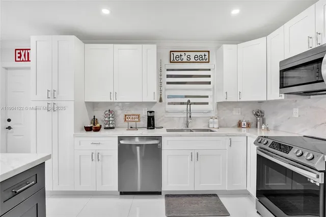 a bathroom with a granite countertop shower sink vanity mirror and toilet