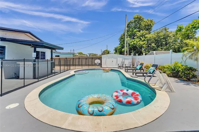 a view of a swimming pool with a patio