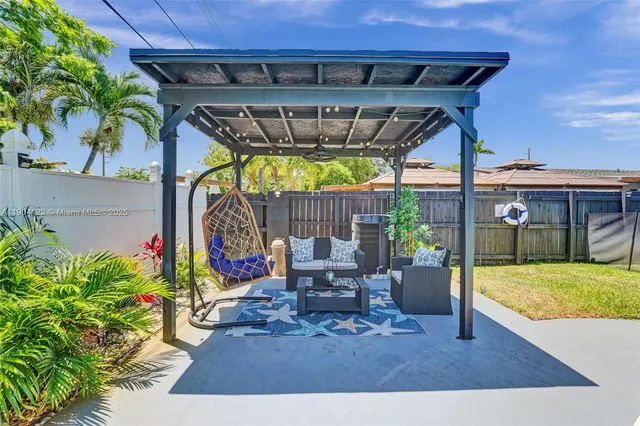 a utility room with sink dryer and washer