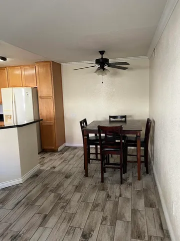 a kitchen with granite countertop a sink and cabinets