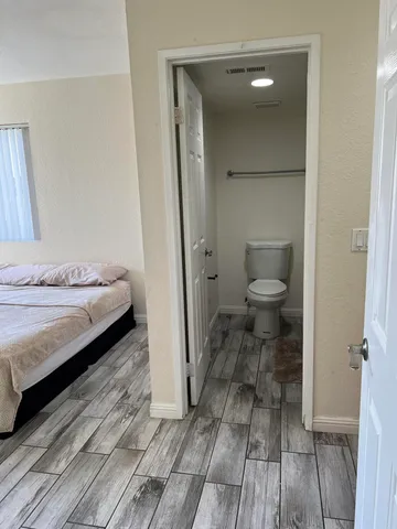 a bathroom with a toilet and a bathtub