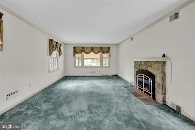 a living room with a fireplace
