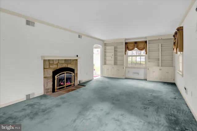 a bathroom with a window and a shower