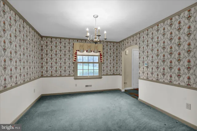 a kitchen with stainless steel appliances granite countertop a refrigerator stove top oven and sink