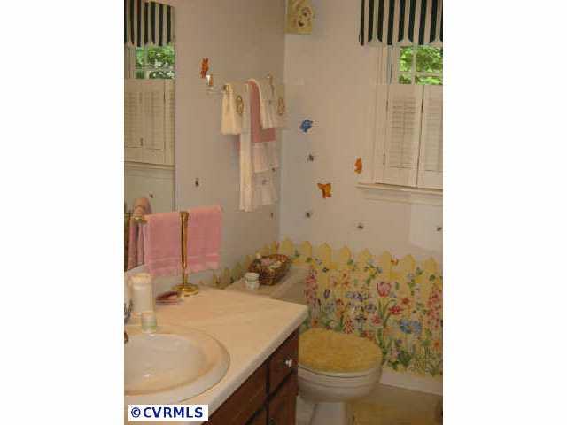 10818 Crofton Road Chester, VA 23831 - Photo 5 of 7 a bathroom with a sink toilet and shower