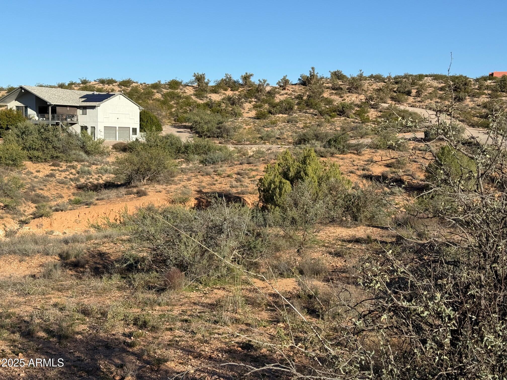 1790 Koch Ranch Road Cornville, AZ 86325 - Photo 9 of 17 a view of a building with mountains in the background