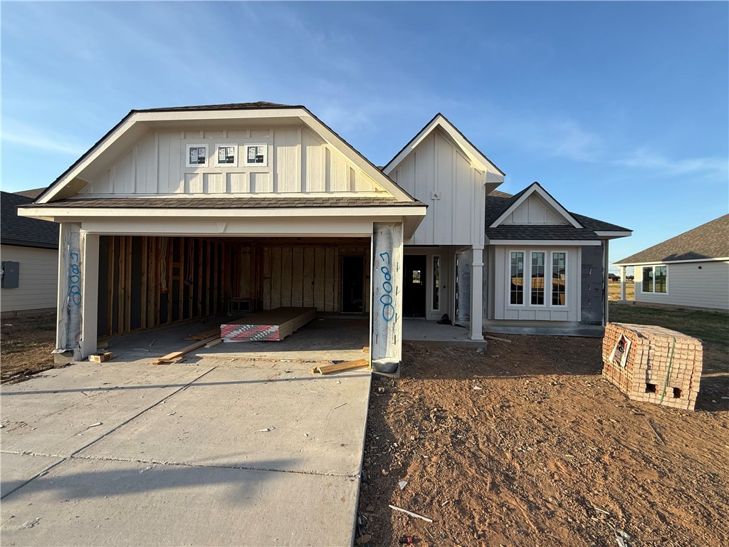7808 Redbud Road Navasota, TX 77868 - Photo 1 of 8 View of front of property featuring driveway, board and batten siding, and a shingled roof