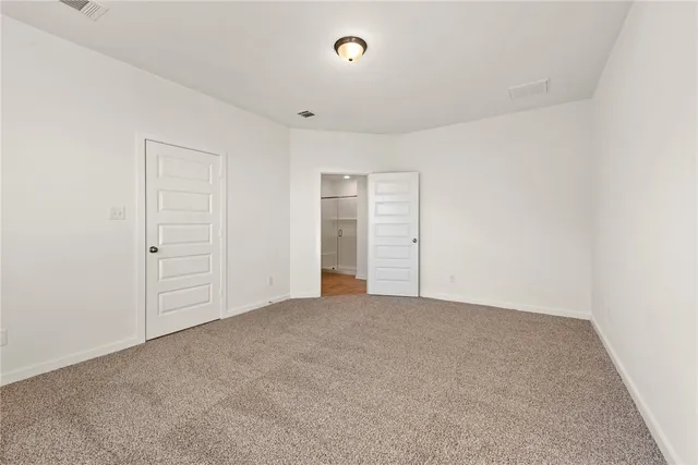a bathroom with a granite countertop sink a toilet and a bathtub