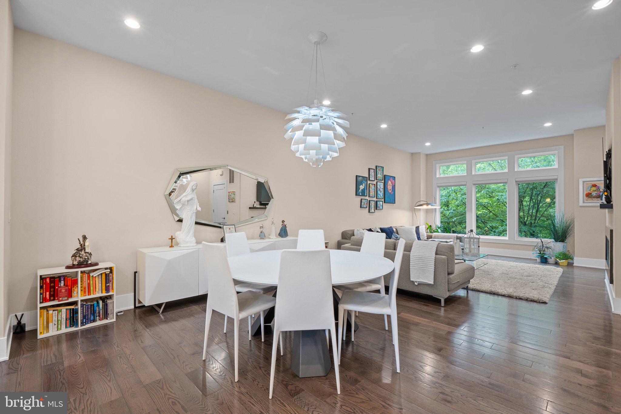 5307 Merriam Street Bethesda, MD 20814 - Photo 11 of 32 a view of a dining room with furniture a chandelier and wooden floor
