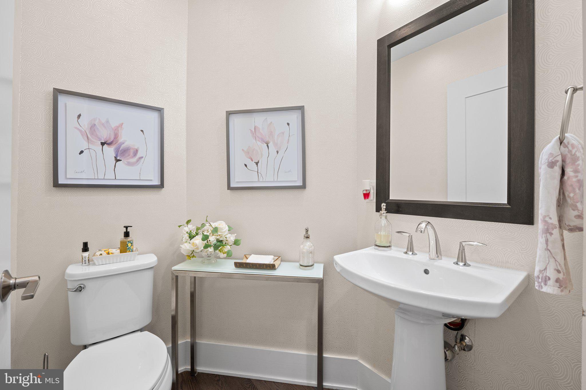 5307 Merriam Street Bethesda, MD 20814 - Photo 17 of 32 a bathroom with a toilet a sink and mirror