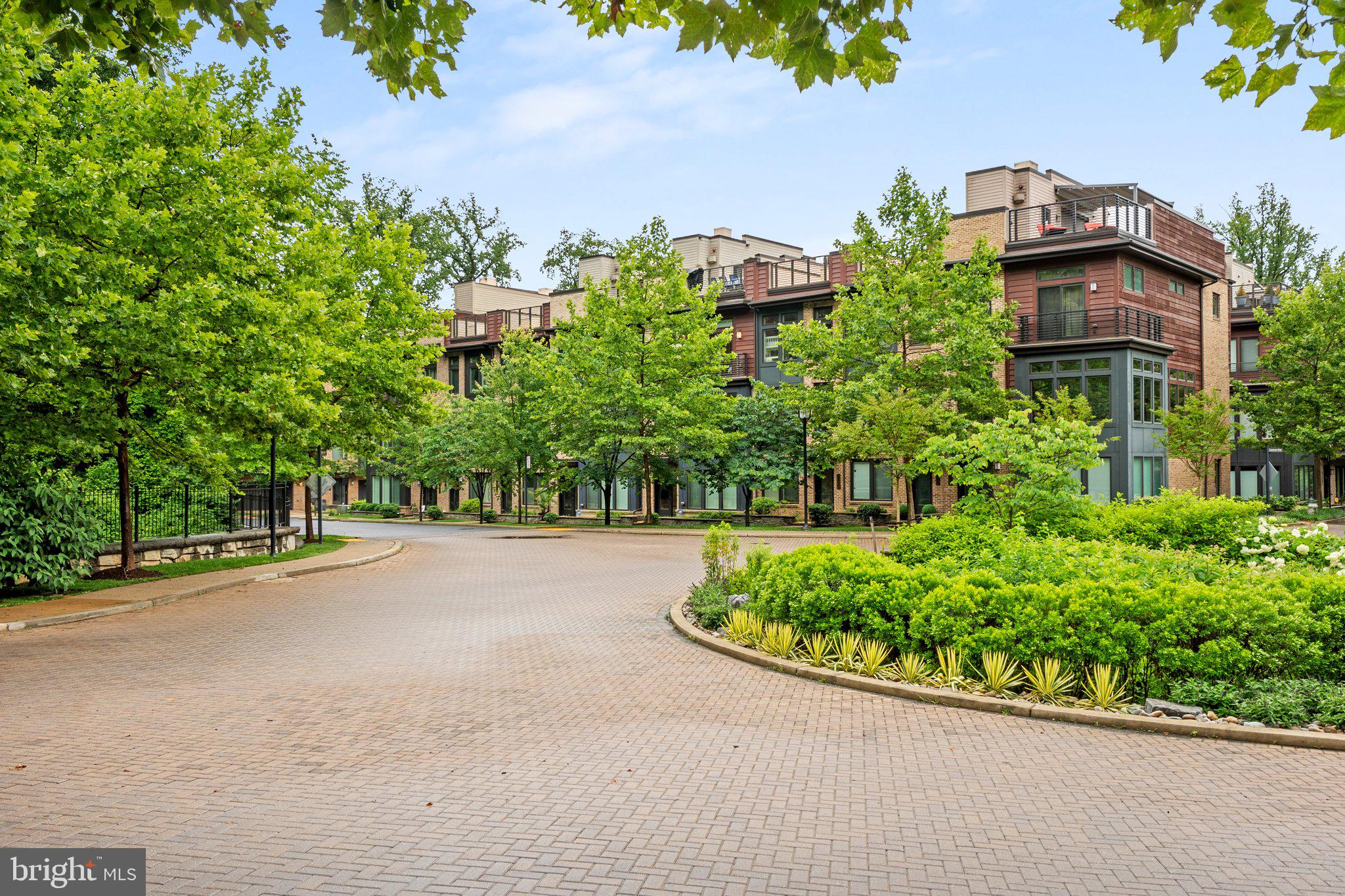 5307 Merriam Street Bethesda, MD 20814 - Photo 2 of 32 front view of a house with a yard and potted plants