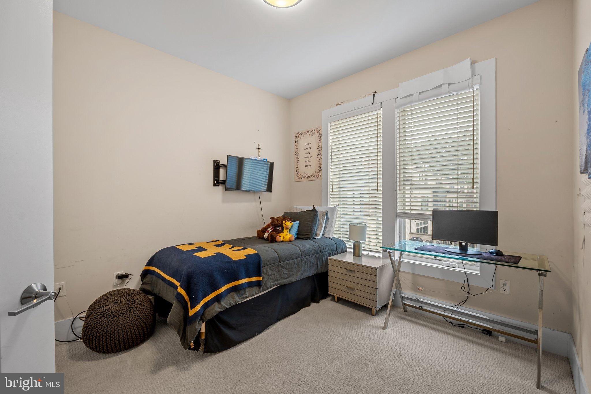 5307 Merriam Street Bethesda, MD 20814 - Photo 22 of 32 a room with a bed and a desk