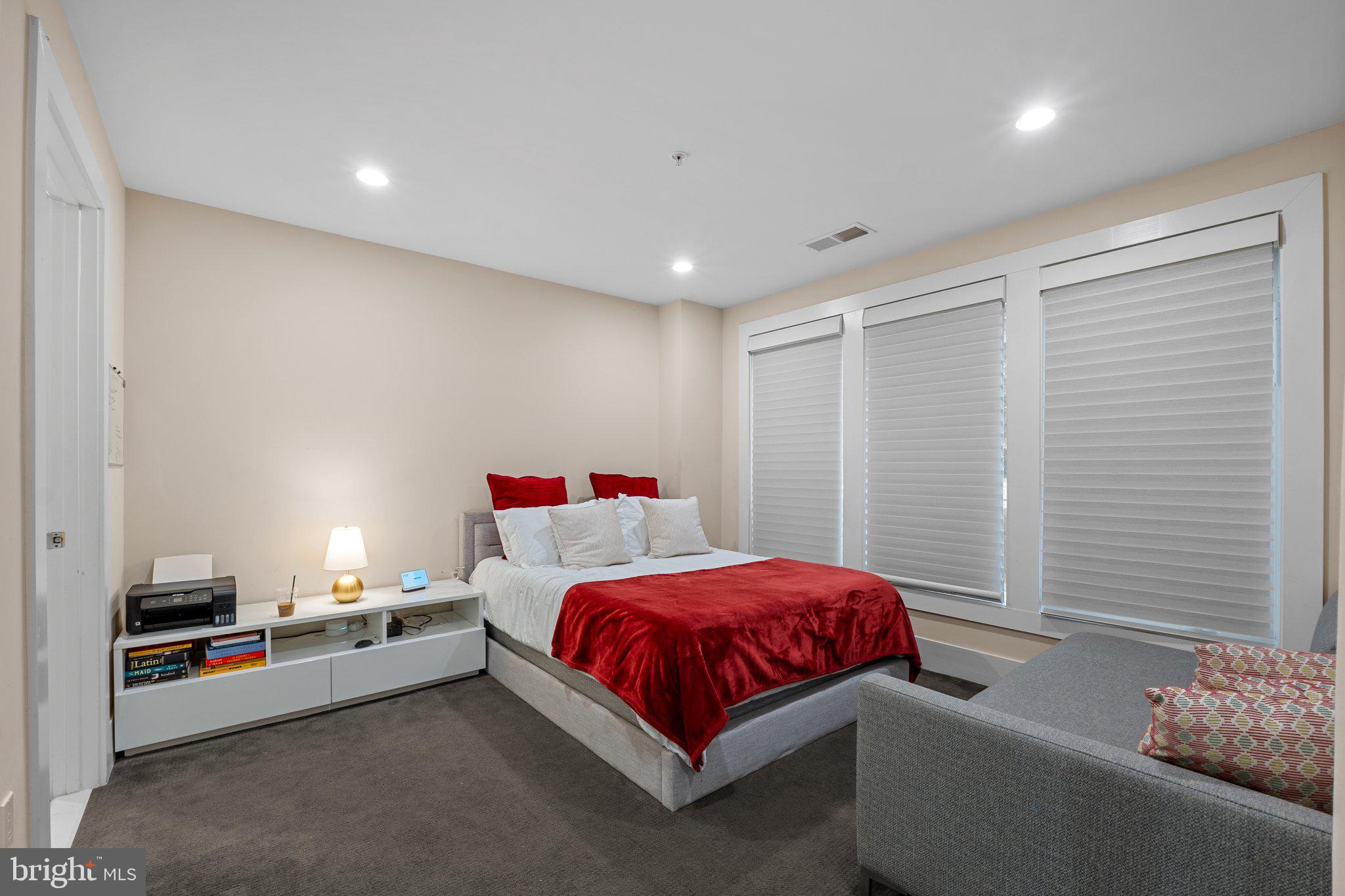 5307 Merriam Street Bethesda, MD 20814 - Photo 27 of 32 a bedroom with a bed and a couch