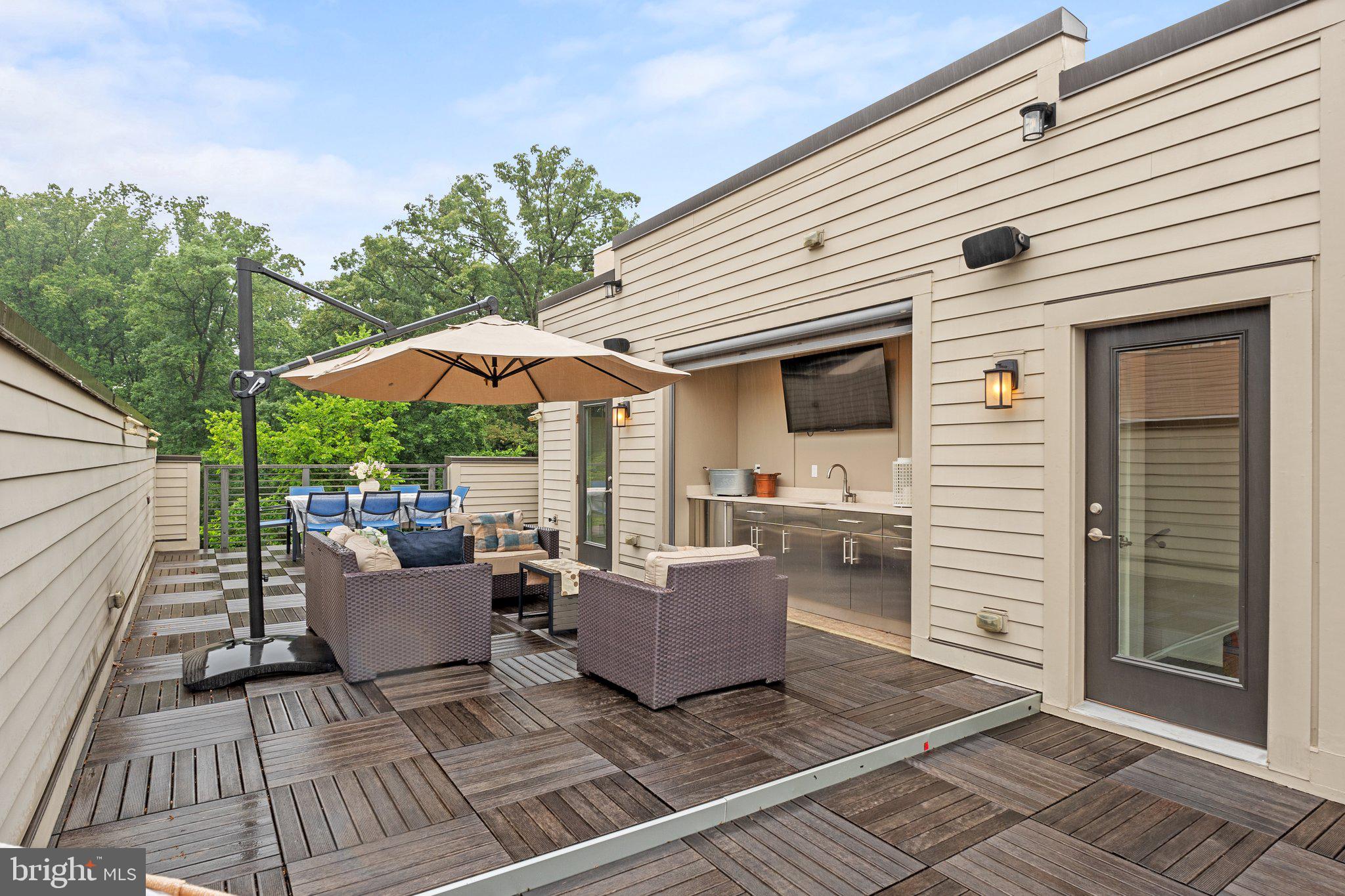 5307 Merriam Street Bethesda, MD 20814 - Photo 30 of 32 a view of a patio with couches and potted plants