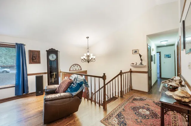 a living room with furniture and a rug