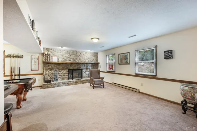 a view of a livingroom with furniture and a fireplace