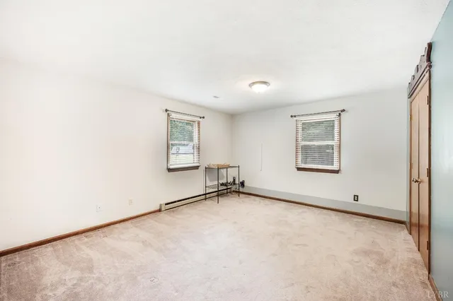 an empty room with windows