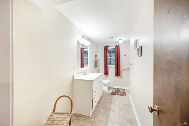 a view of a bathroom with bathtub and shower
