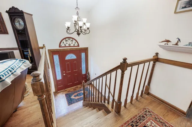 a view of entryway with stairs and wooden floor