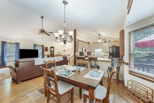 a view of a dining room and livingroom furniture and a chandelier
