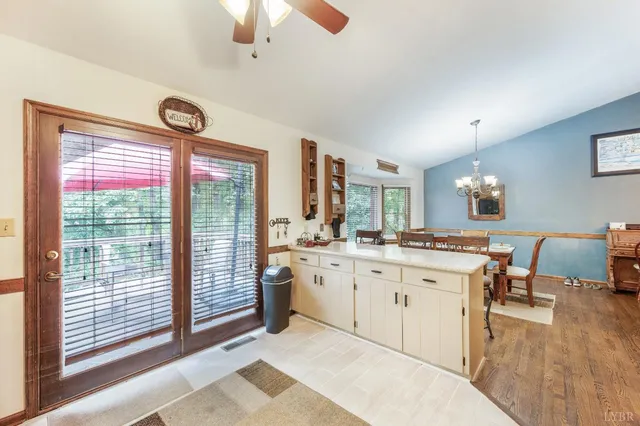a large white kitchen with a large window