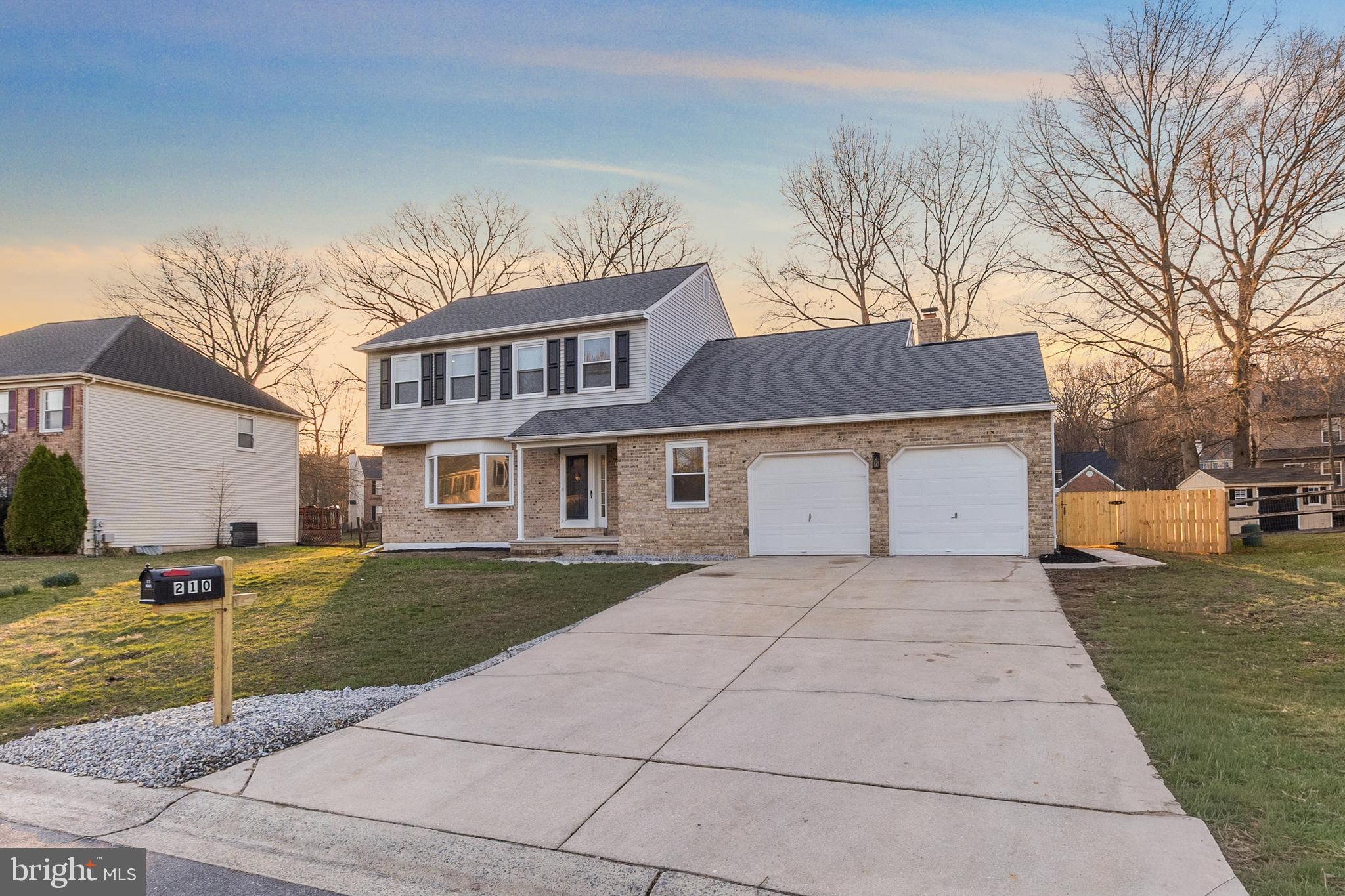 210 West Silver Fox Road Newark, DE 19702 - Photo 3 of 43 a front view of a house with garden