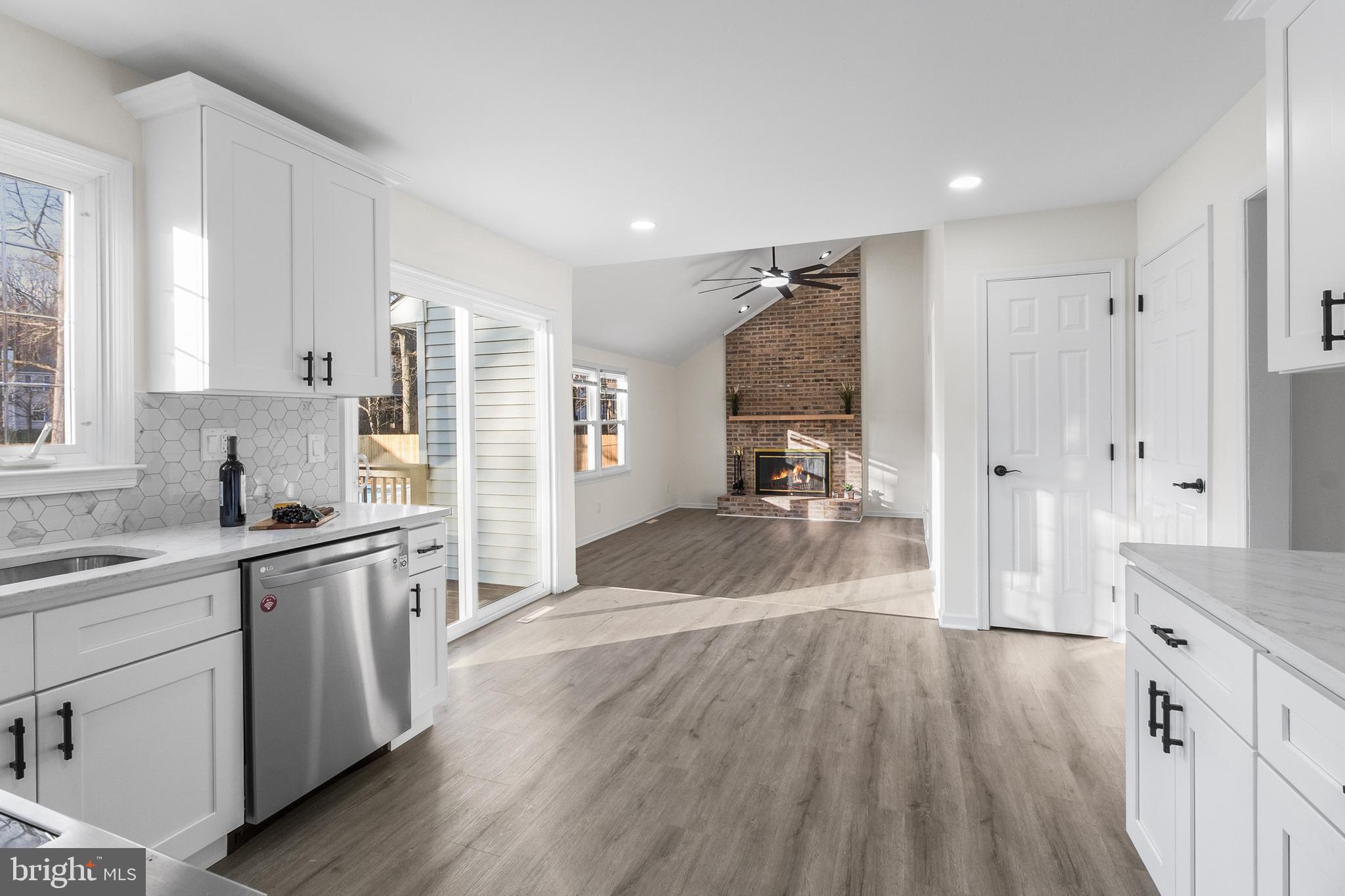 210 West Silver Fox Road Newark, DE 19702 - Photo 9 of 43 a large kitchen with a lot of counter space and wooden floor