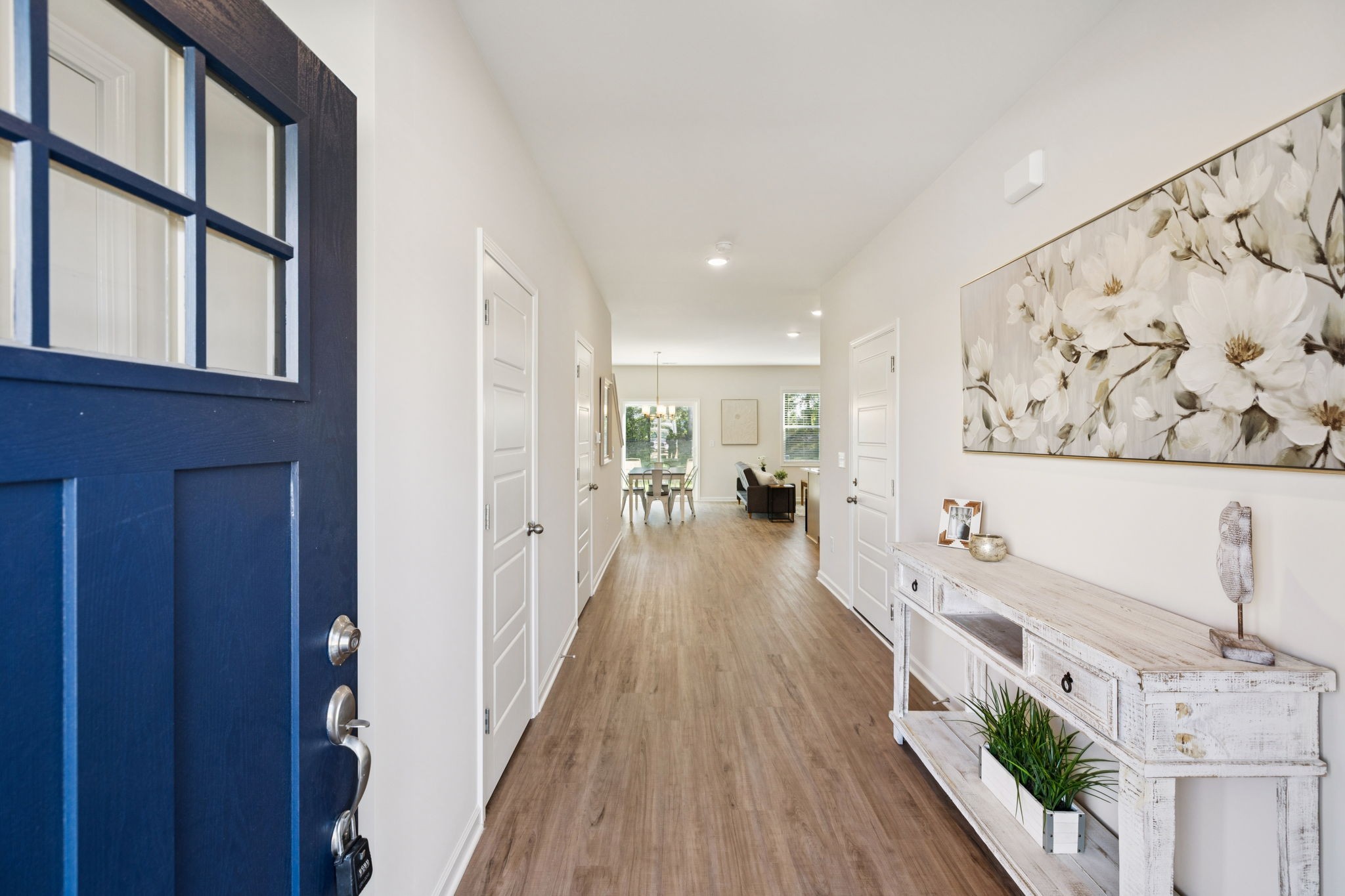 a view of a living room and a wooden floor