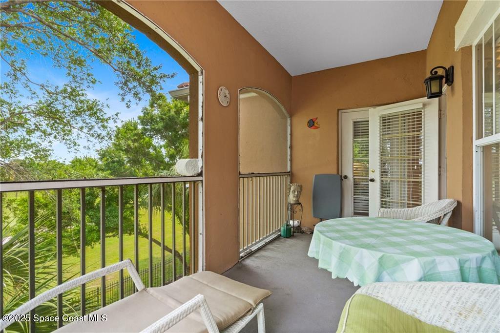 Undisclosed Address Vero Beach, FL 32967 - Photo 12 of 34 a bedroom with furniture and a large window