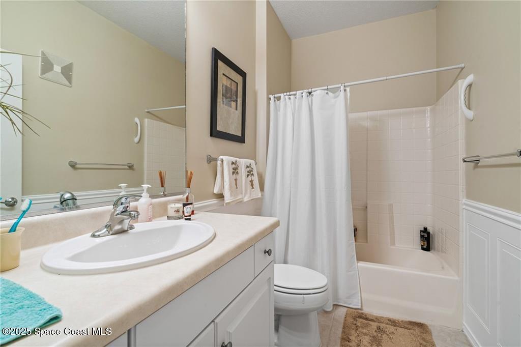 Undisclosed Address Vero Beach, FL 32967 - Photo 18 of 34 a bathroom with a sink toilet and shower