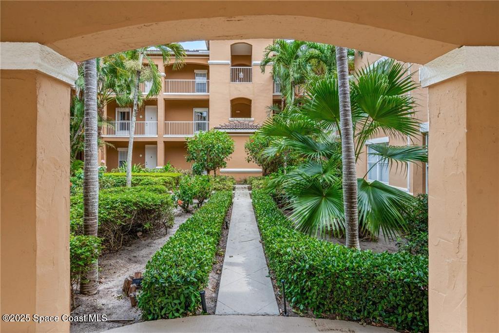 Undisclosed Address Vero Beach, FL 32967 - Photo 21 of 34 a view of a pathway with a building in front of it